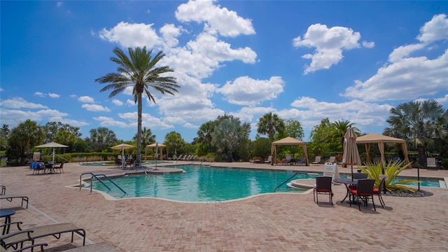 community pool featuring a patio area and a gazebo