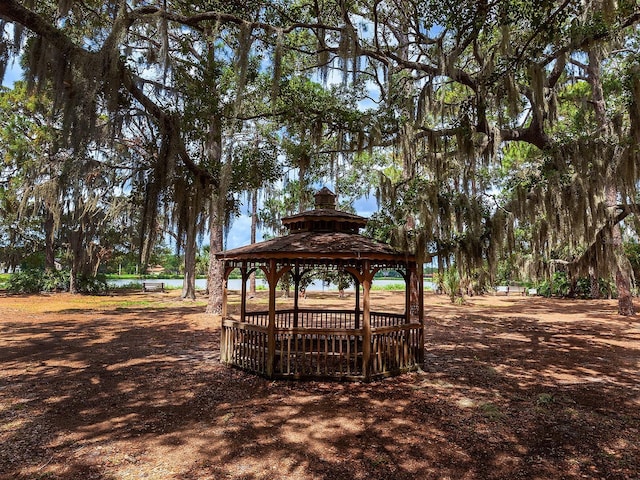 view of home's community featuring a water view and a gazebo