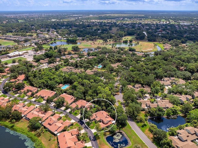 birds eye view of property featuring a residential view and a water view