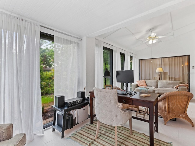 sunroom with vaulted ceiling and a ceiling fan