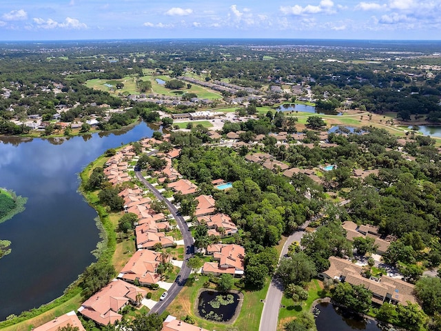 birds eye view of property featuring a water view and a residential view