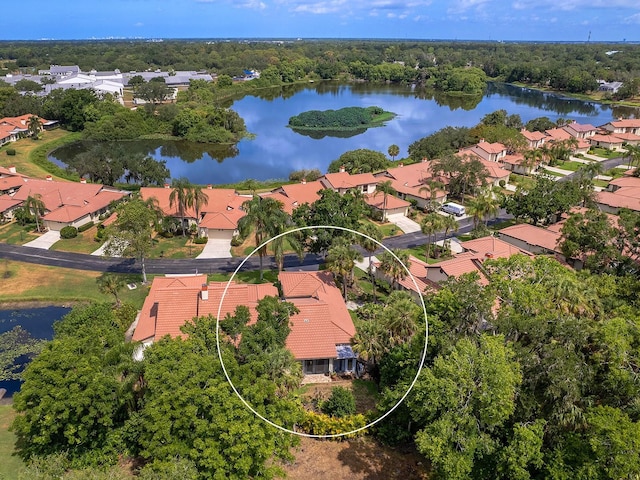 bird's eye view featuring a water view and a residential view