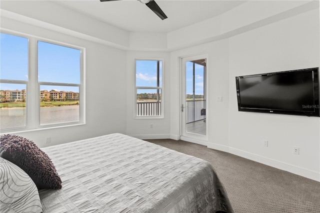 carpeted bedroom featuring access to outside and ceiling fan