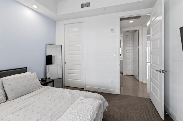 bedroom with a closet and carpet flooring