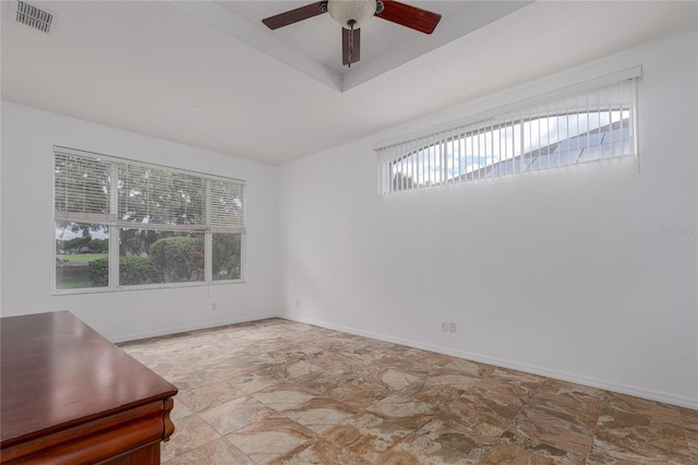 spare room with ceiling fan and a healthy amount of sunlight