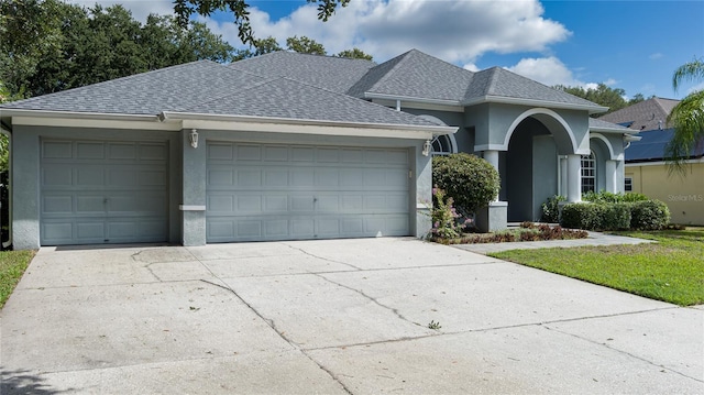 ranch-style home with a garage