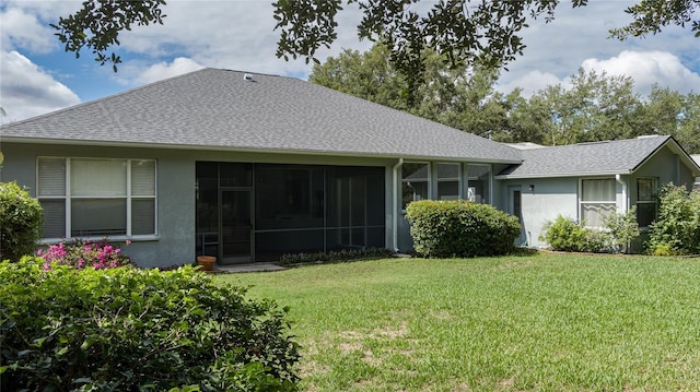 back of property featuring a yard and a sunroom