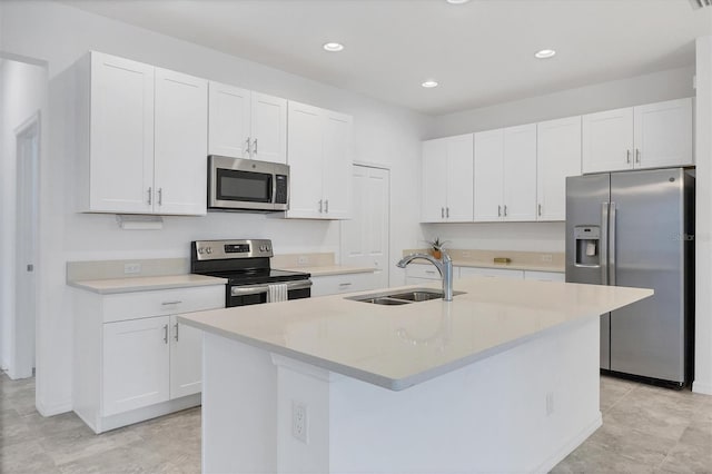 kitchen with white cabinets, sink, and appliances with stainless steel finishes