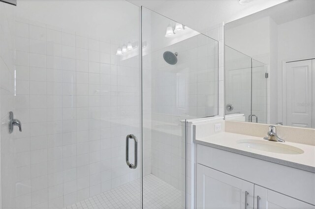 bathroom with vanity and an enclosed shower