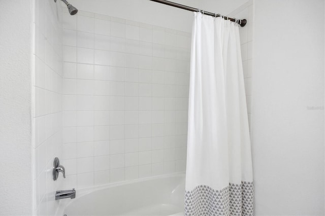 bathroom featuring shower / bathtub combination with curtain