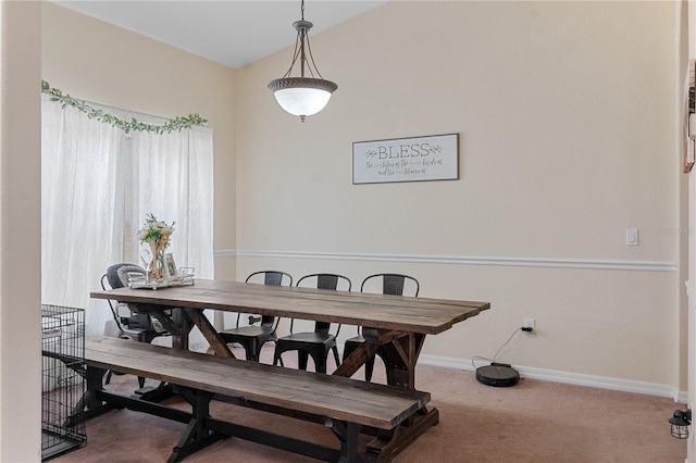 view of carpeted dining space