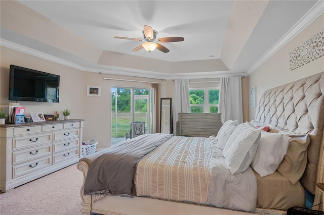 bedroom with carpet flooring, access to outside, a raised ceiling, and ceiling fan