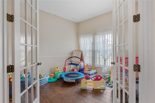 rec room with french doors and dark hardwood / wood-style floors