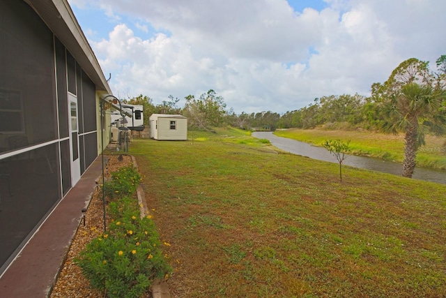 view of yard with a storage unit