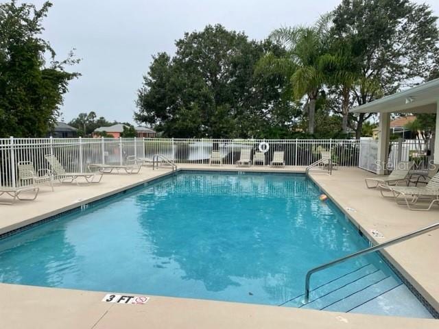 view of swimming pool with a patio