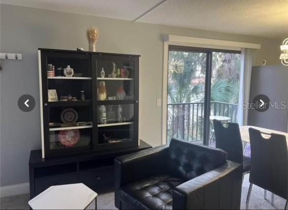 living area featuring a chandelier