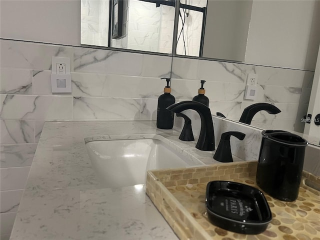 interior details with sink and decorative backsplash