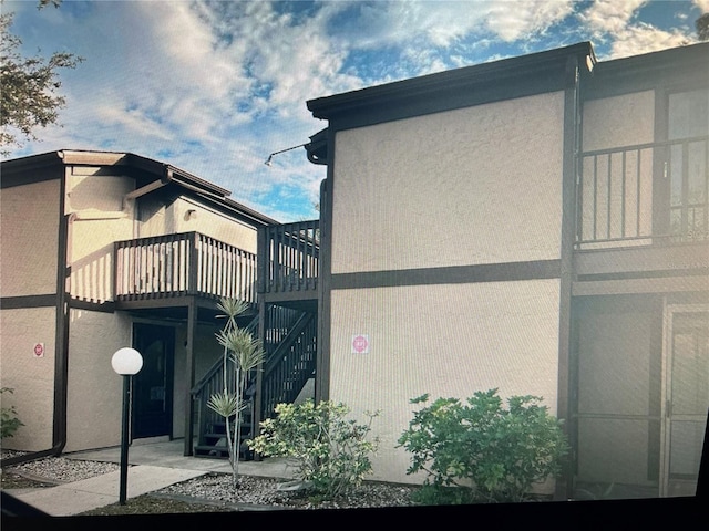 view of home's exterior featuring a balcony