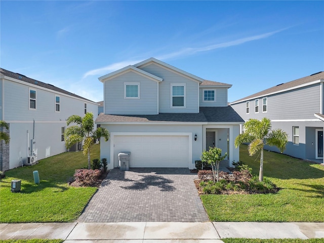 view of front property with a front yard and a garage