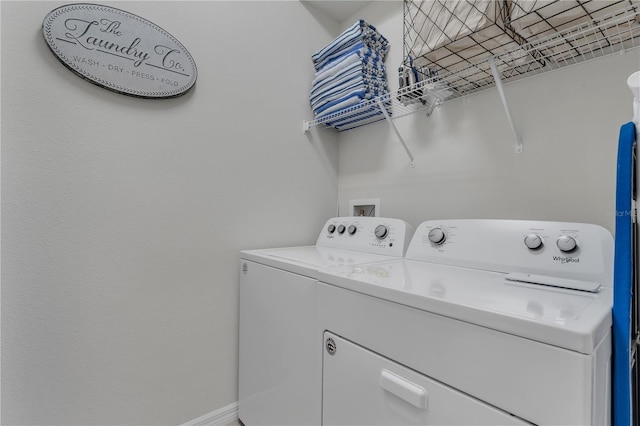 laundry room featuring separate washer and dryer