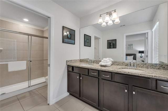 bathroom with walk in shower, tile patterned floors, vanity, and toilet