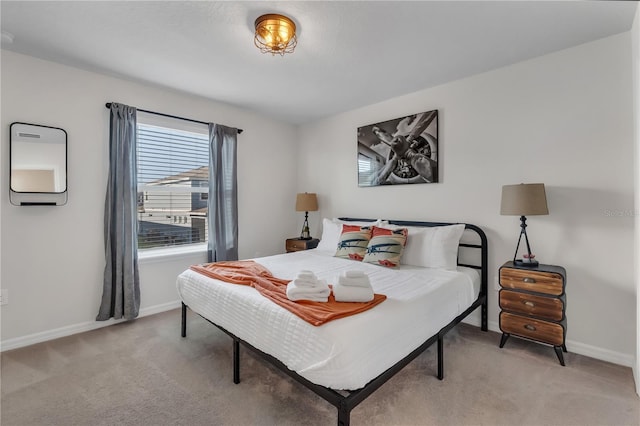 bedroom featuring light colored carpet