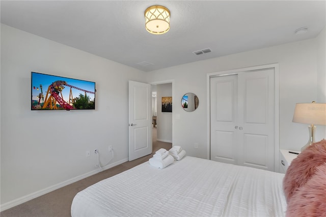 bedroom with a closet and carpet floors