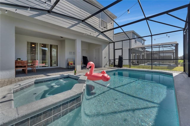 view of swimming pool with glass enclosure, an in ground hot tub, and a patio