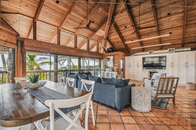 tiled dining room with wood walls, wood ceiling, beam ceiling, and high vaulted ceiling