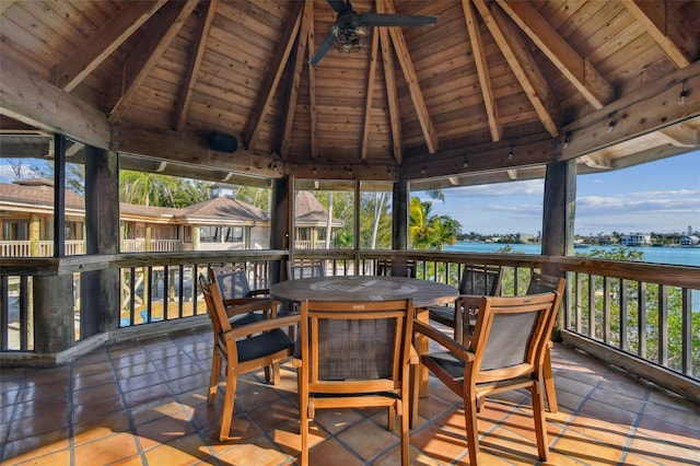 wooden deck featuring a gazebo, ceiling fan, and a water view