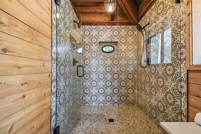 bathroom with wood walls and a shower with door