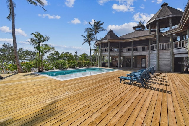 view of swimming pool featuring a wooden deck