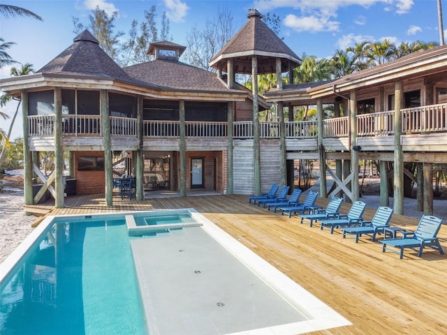 view of swimming pool with a deck