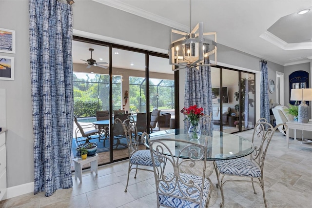 dining space featuring ceiling fan with notable chandelier and ornamental molding