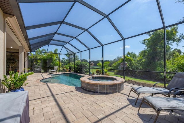 view of swimming pool featuring a lanai, a patio area, and an in ground hot tub