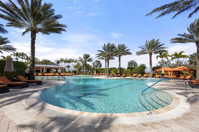 view of swimming pool featuring a gazebo and a patio area