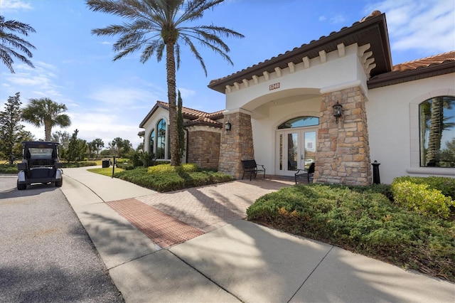 view of property exterior with french doors