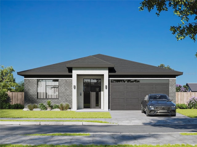 view of front facade featuring a garage and a front lawn