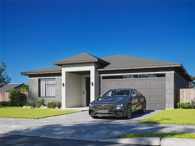 prairie-style home featuring a front yard and a garage