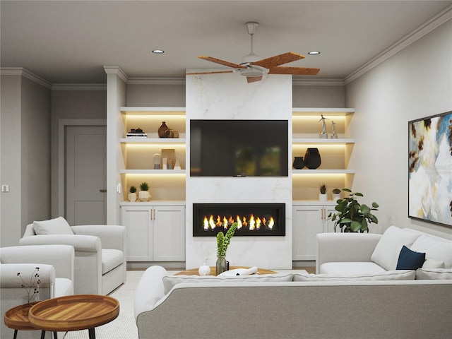 living room featuring built in features, ceiling fan, and ornamental molding