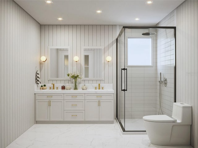 bathroom with vanity, wood walls, toilet, and a shower with shower door