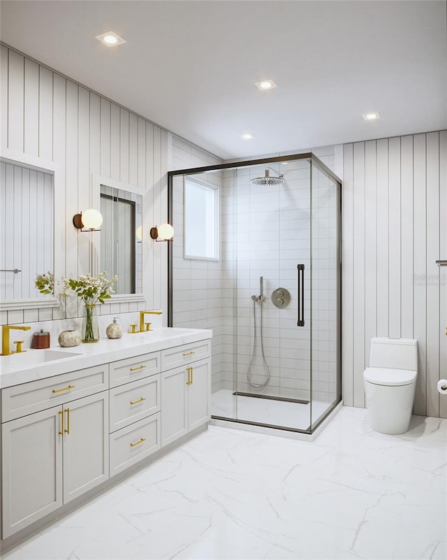 bathroom with vanity, toilet, and an enclosed shower