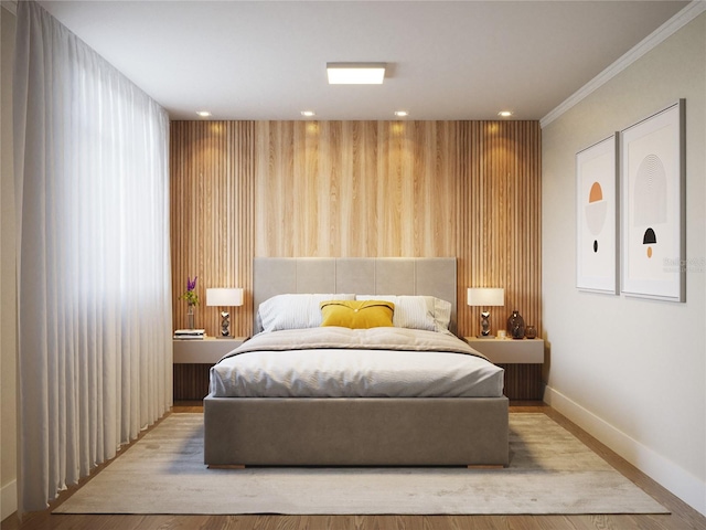 bedroom with light hardwood / wood-style floors and ornamental molding