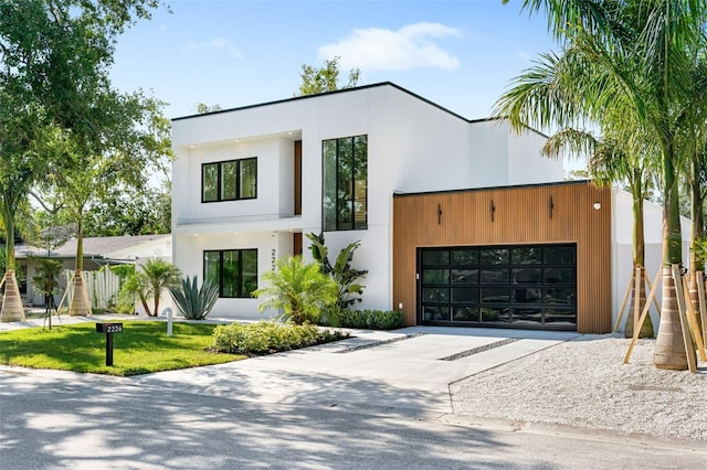 contemporary house featuring stucco siding and concrete driveway