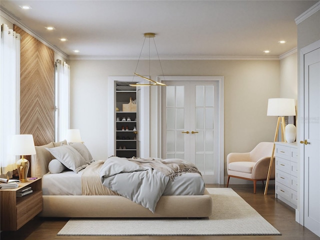 bedroom with dark hardwood / wood-style floors and ornamental molding