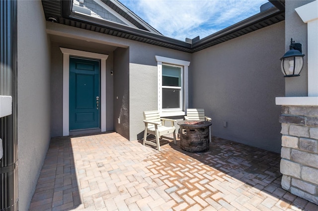 entrance to property with a patio area