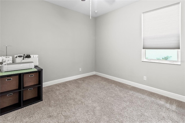 carpeted empty room with ceiling fan