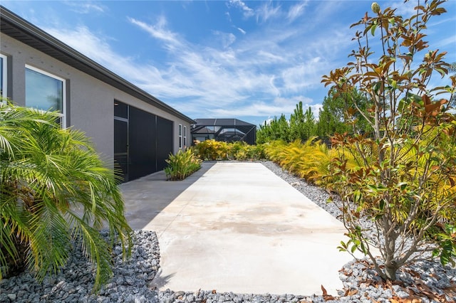 view of patio with a lanai