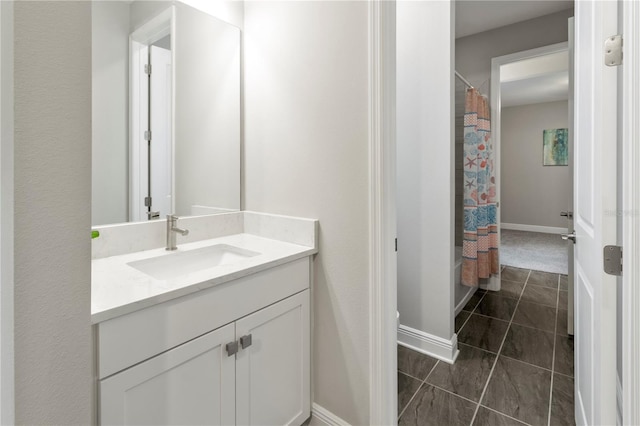 bathroom featuring tile patterned floors, vanity, and shower / bathtub combination with curtain