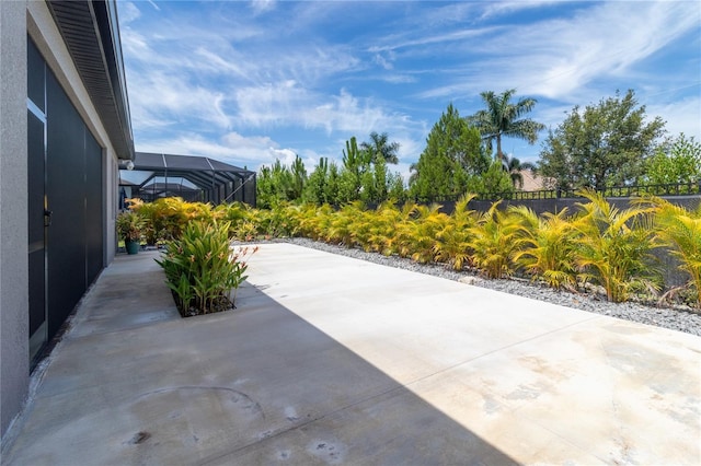 view of patio / terrace with a lanai